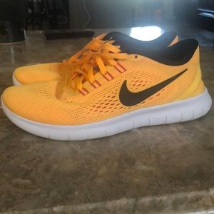 Light orange nike free run natural running shoes